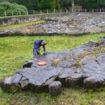 A Mapa Scotland member takes a break from cleaning the surface of the map