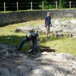 Mapa Scotland member shovelling away loose rubble from the map