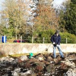 A Mapa Scotland member pressure blasting moss off the surface of the map